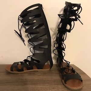 Below the knee gladiator tie sandals